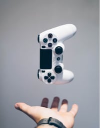 image of a a joystick falling in a opened hand